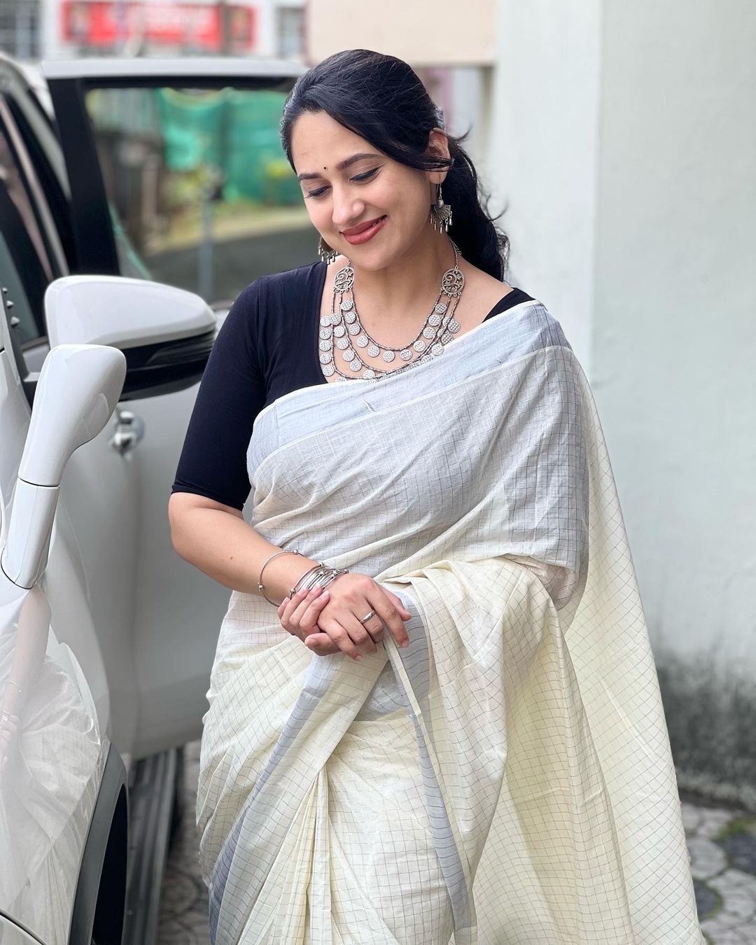 Malayalam Actress Miya George Stills in White Saree Black Blouse